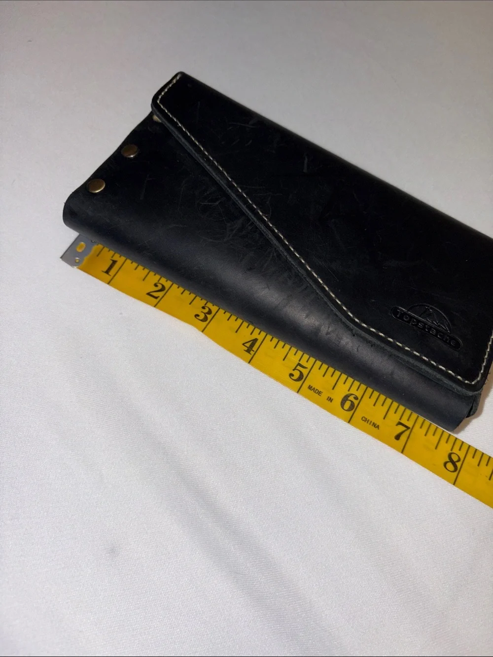 Cellphone case made to fit on belt magnetic closure inside pocket for cards
